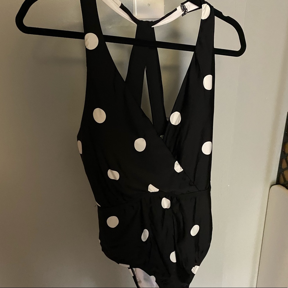 Black and white polka dot swimsuit.